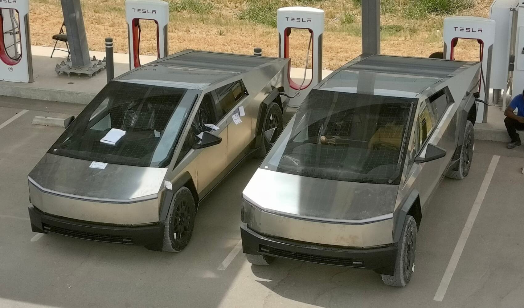 2 Tesla Cybertrucks charging outside the Gigafactory Texas