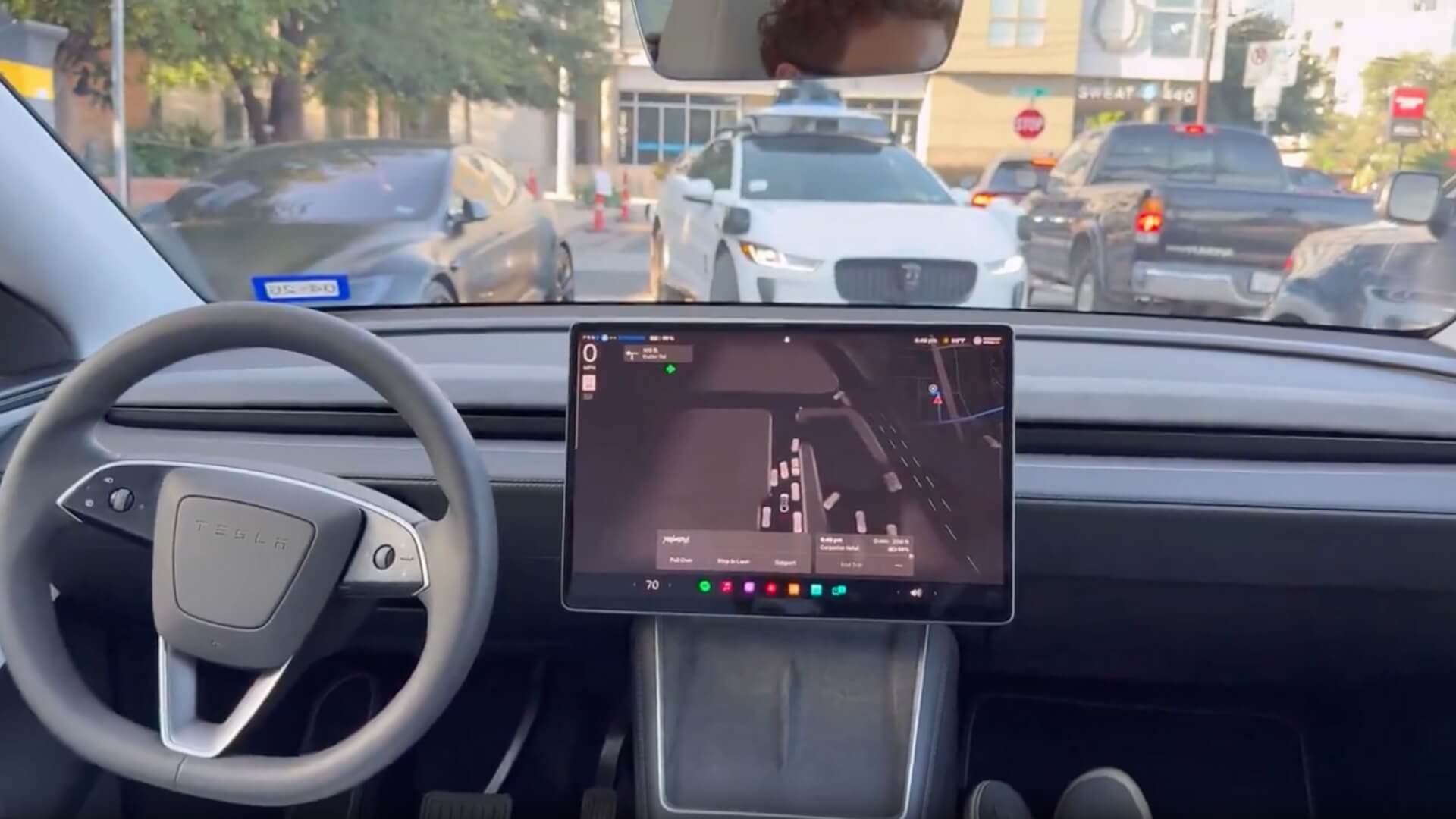 Tesla Robotaxi and Waymo Face Off